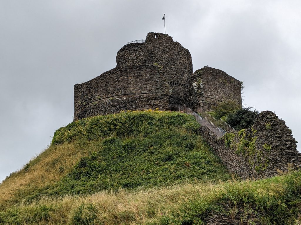 A photograph looking up at Launceston Castle, a Norman Motte and Bailey castle in North Cornwall.